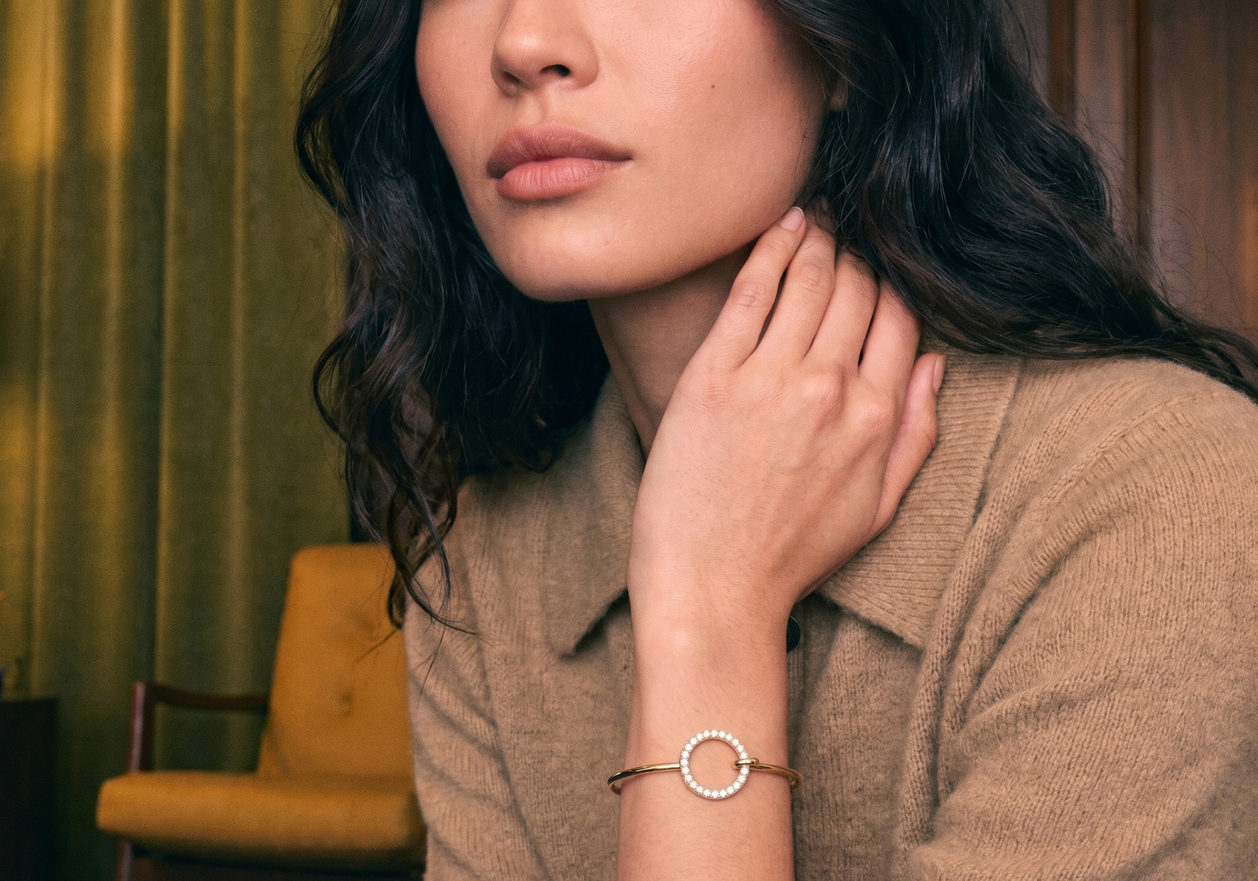 Lab grown diamond tennis bracelet in yellow gold on a woman's wrist