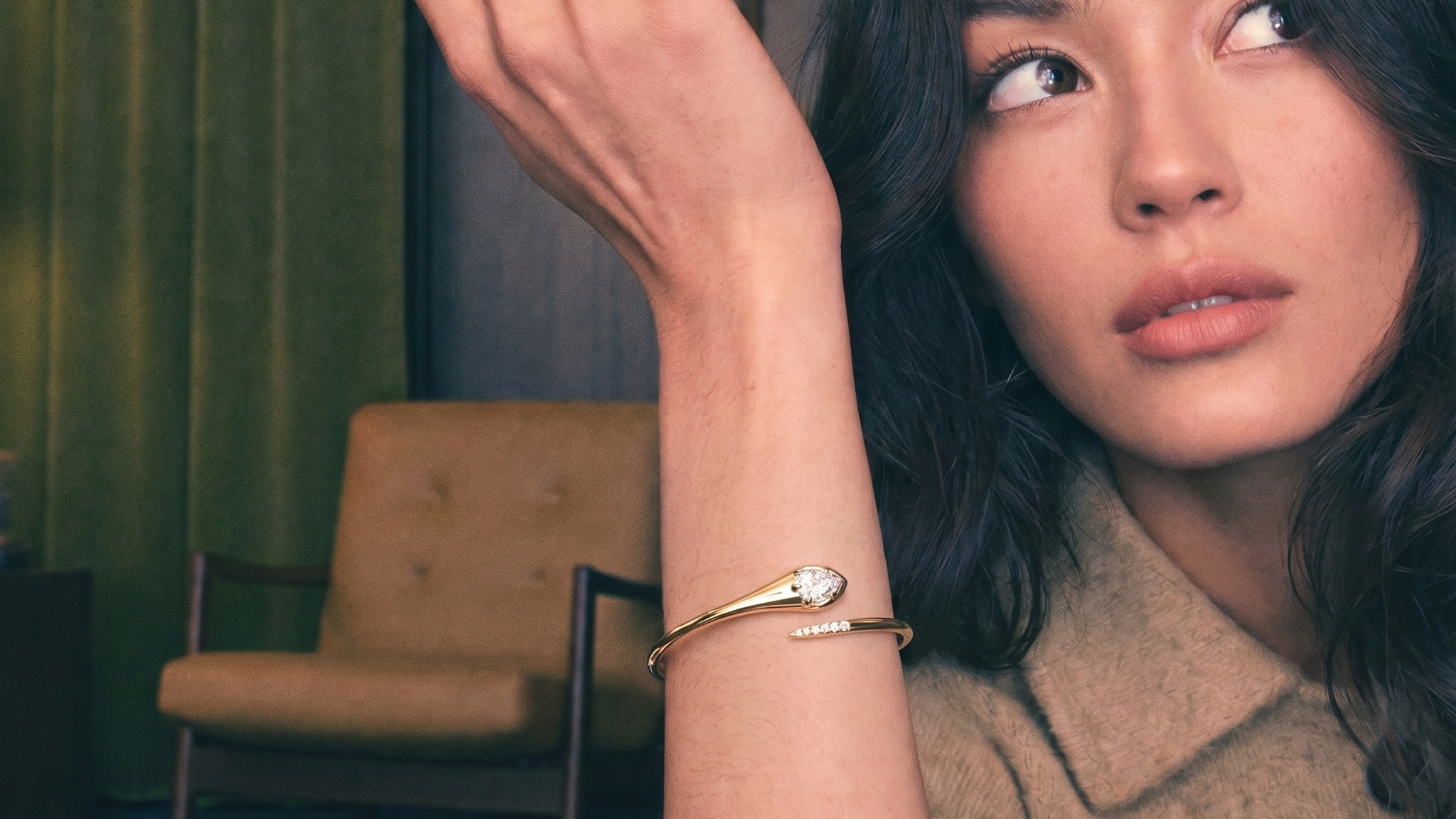 Pear-shaped lab grown diamond tennis bracelet on soft fabric in warm natural light