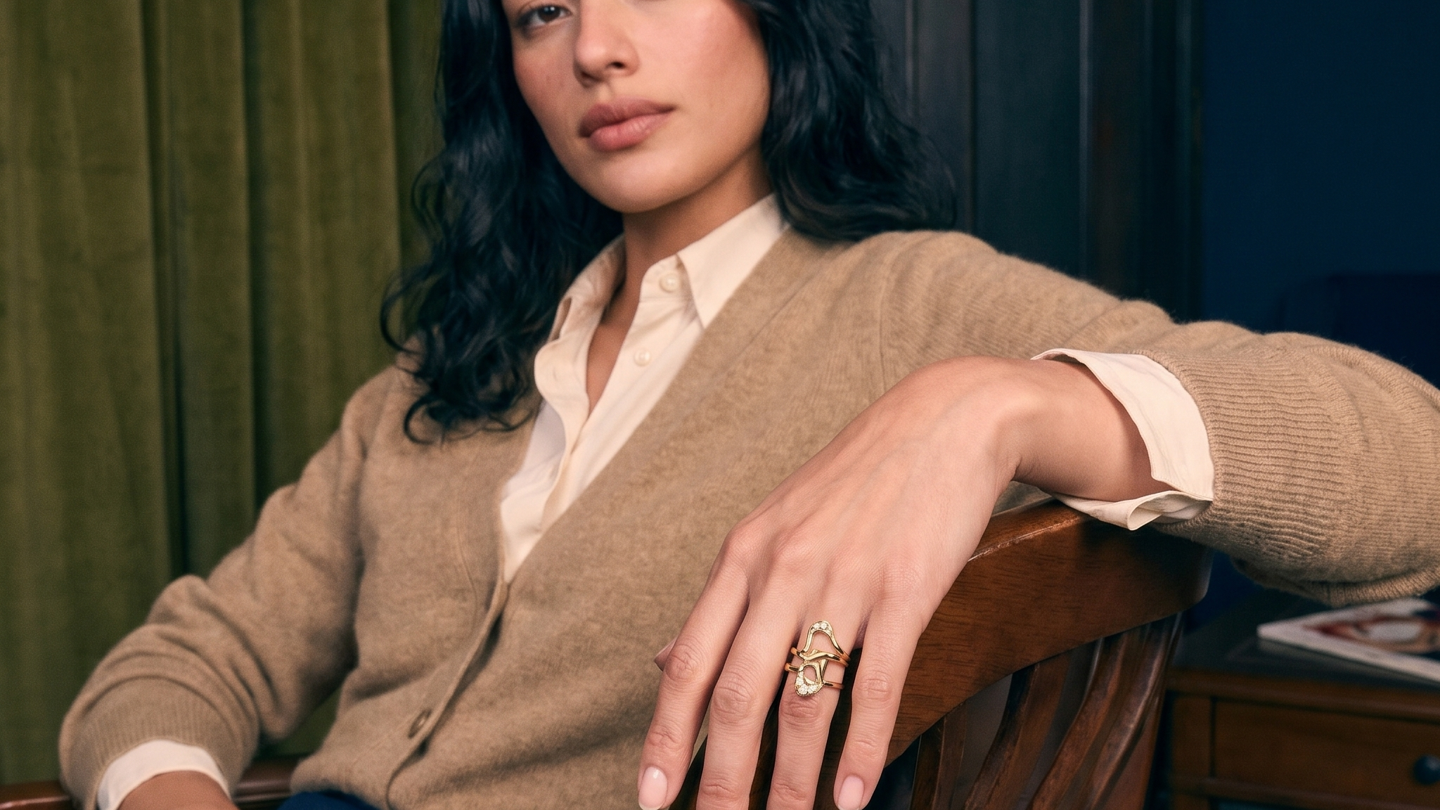 Handcrafted custom lab grown diamond engagement ring in solid gold, worn on the hand in natural light