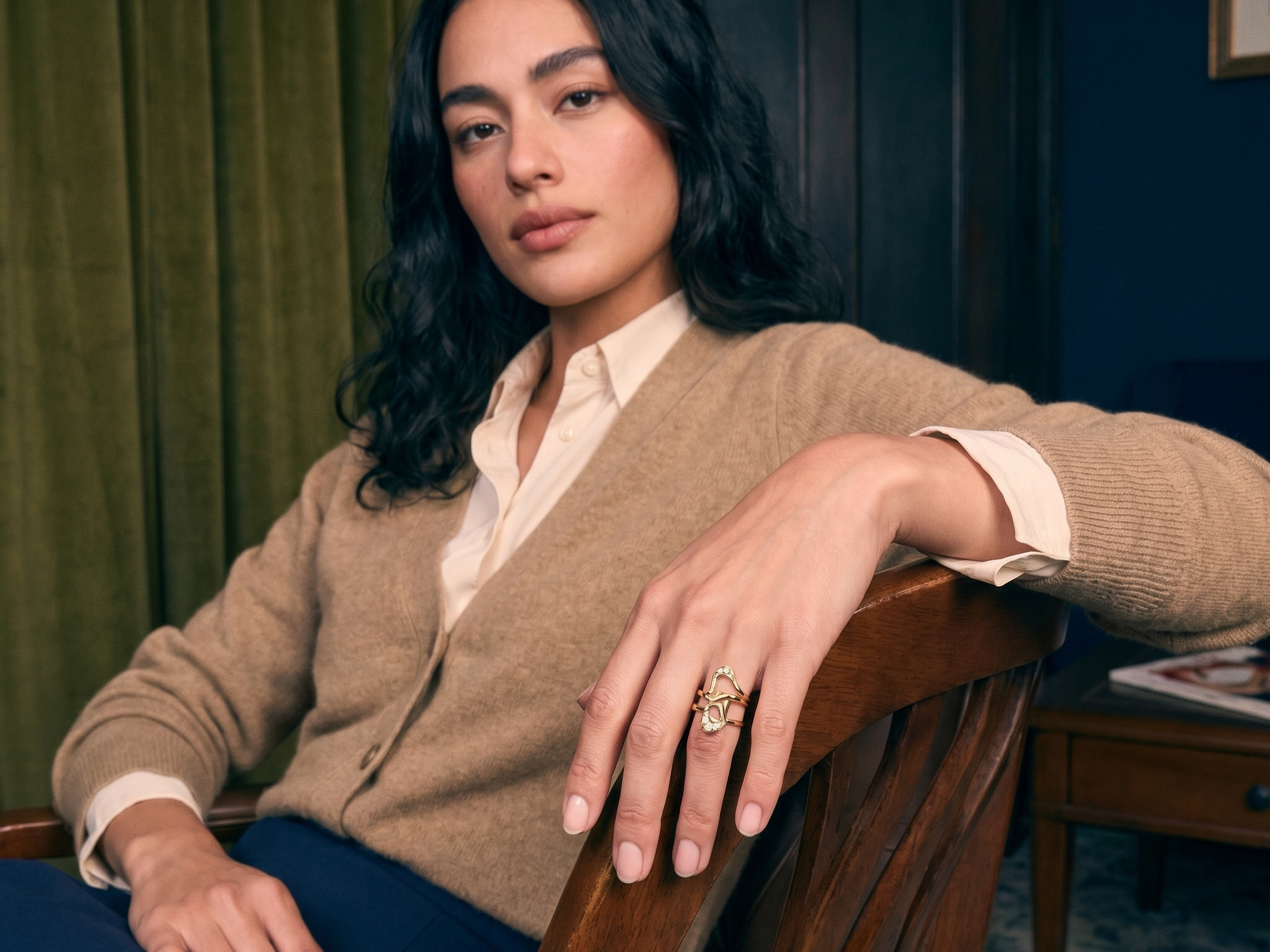 Handcrafted custom lab grown diamond engagement ring in solid gold, worn on the hand in natural light