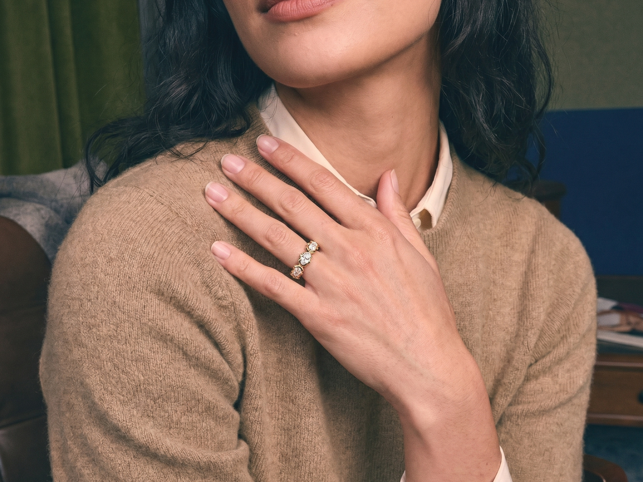 Elongated marquise diamond eternity band on a woman's hand in warm golden light