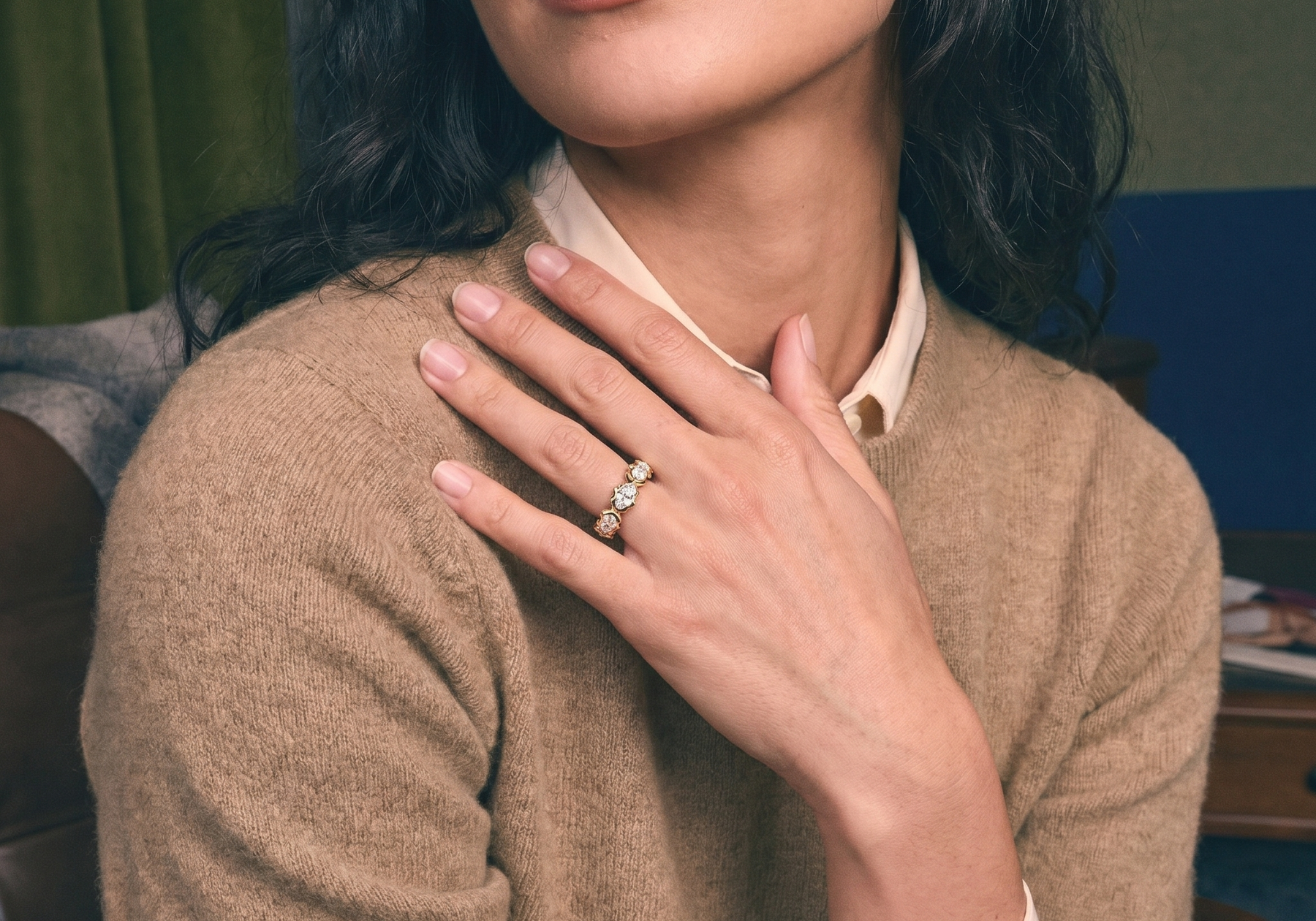 Solid gold diamond eternity band worn on the hand, showing 14k vs 18k gold color in natural light