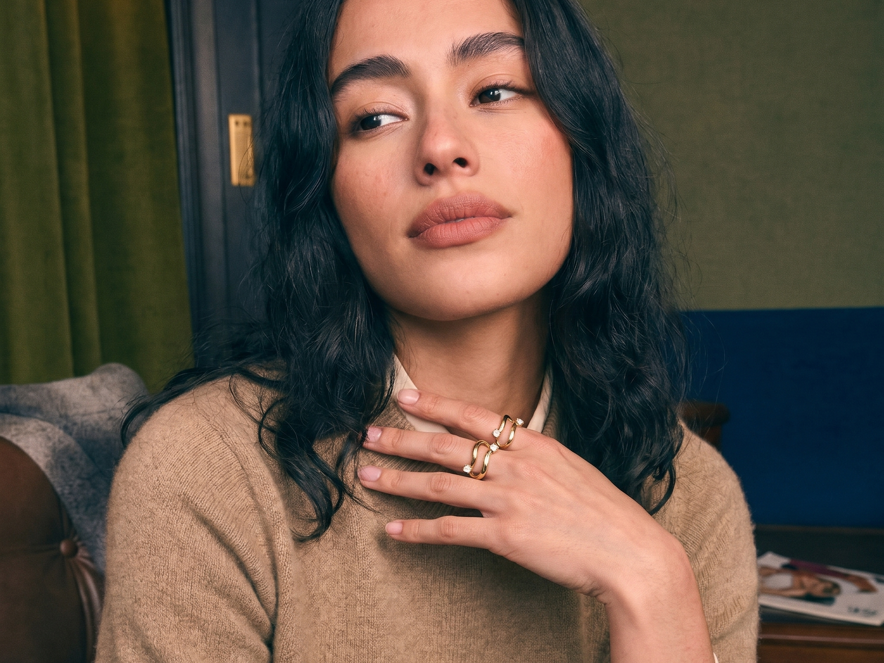 Two-stone toi et moi bypass ring in solid gold worn on a hand, two lab-grown diamonds set side by side