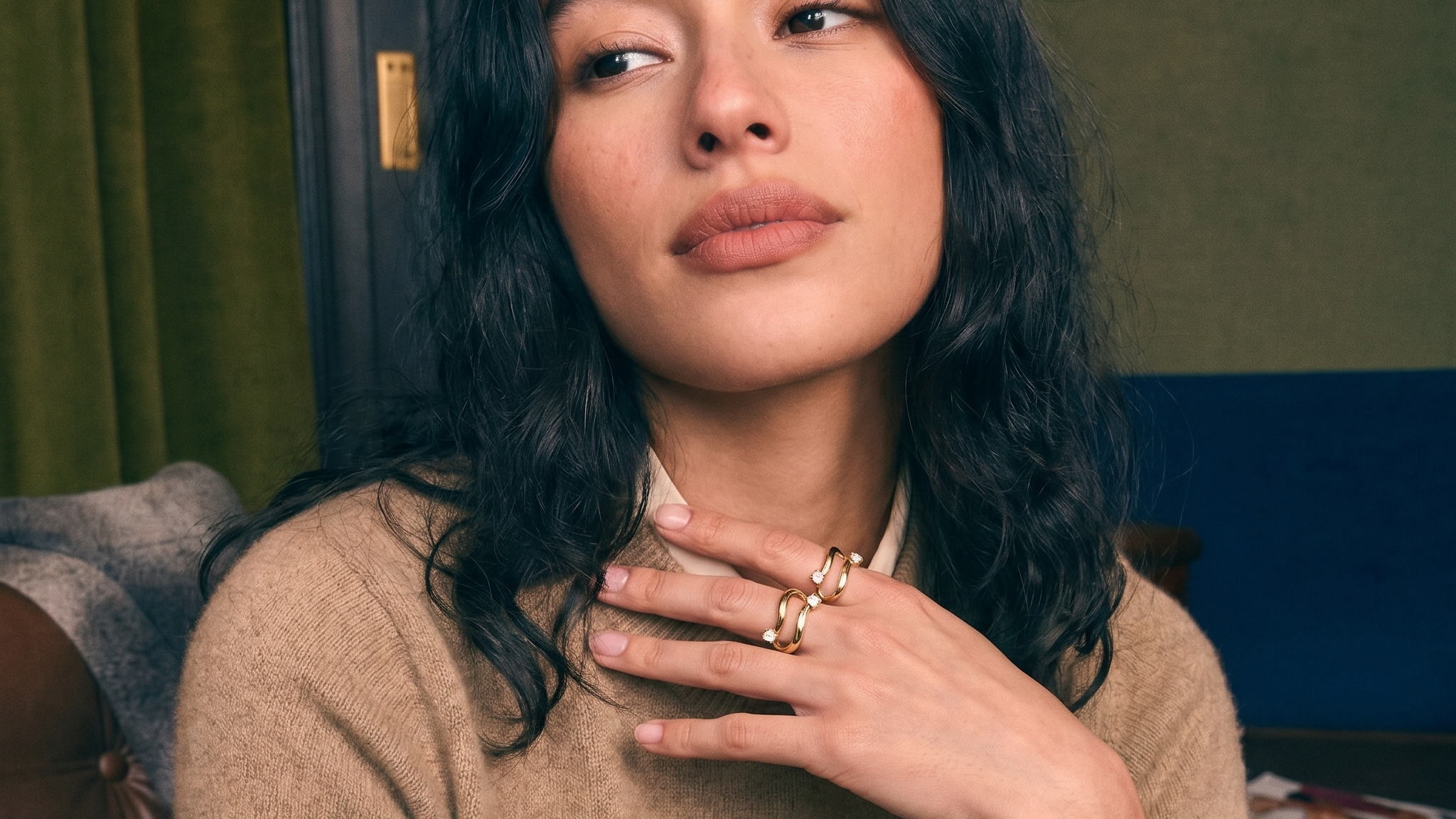 Toi et moi two-stone diamond ring worn on the hand in soft natural light