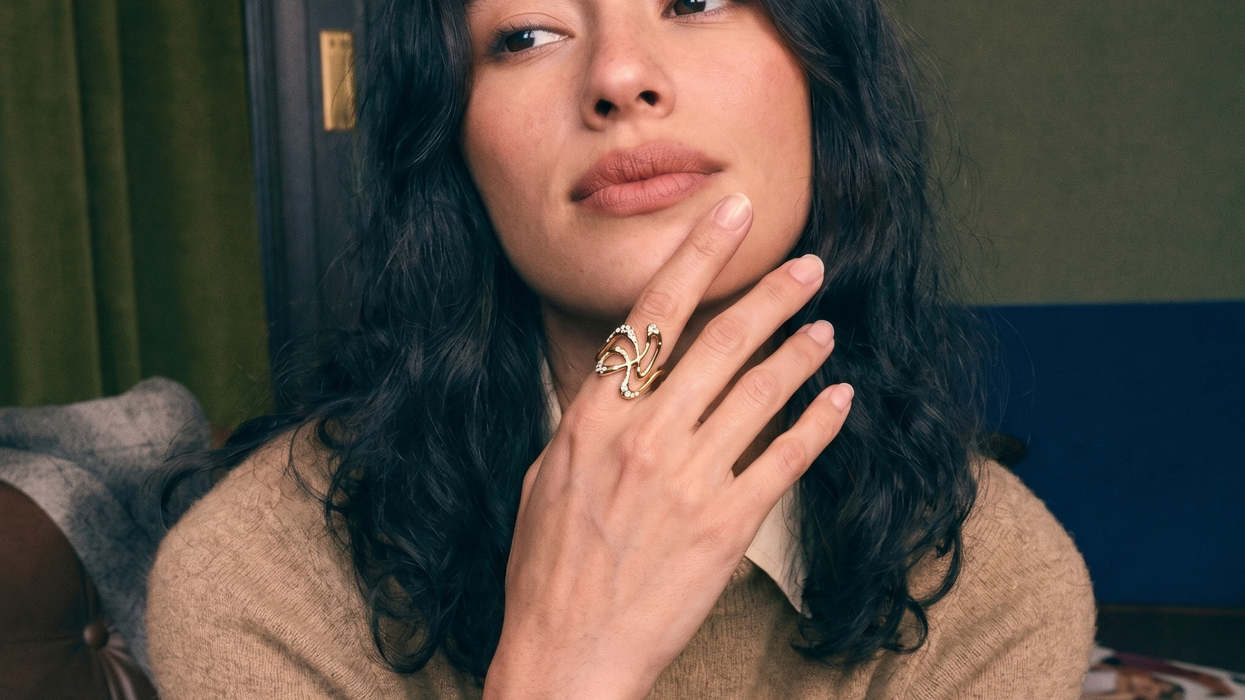 Solid gold lab grown diamond ring on a hand in soft natural light, cushion cut diamond buying guide