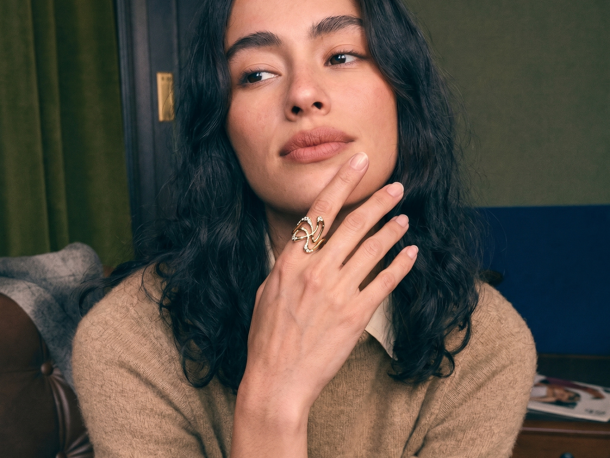 Heirloom diamond redesigned into a sculptural gold ring, worn on the hand