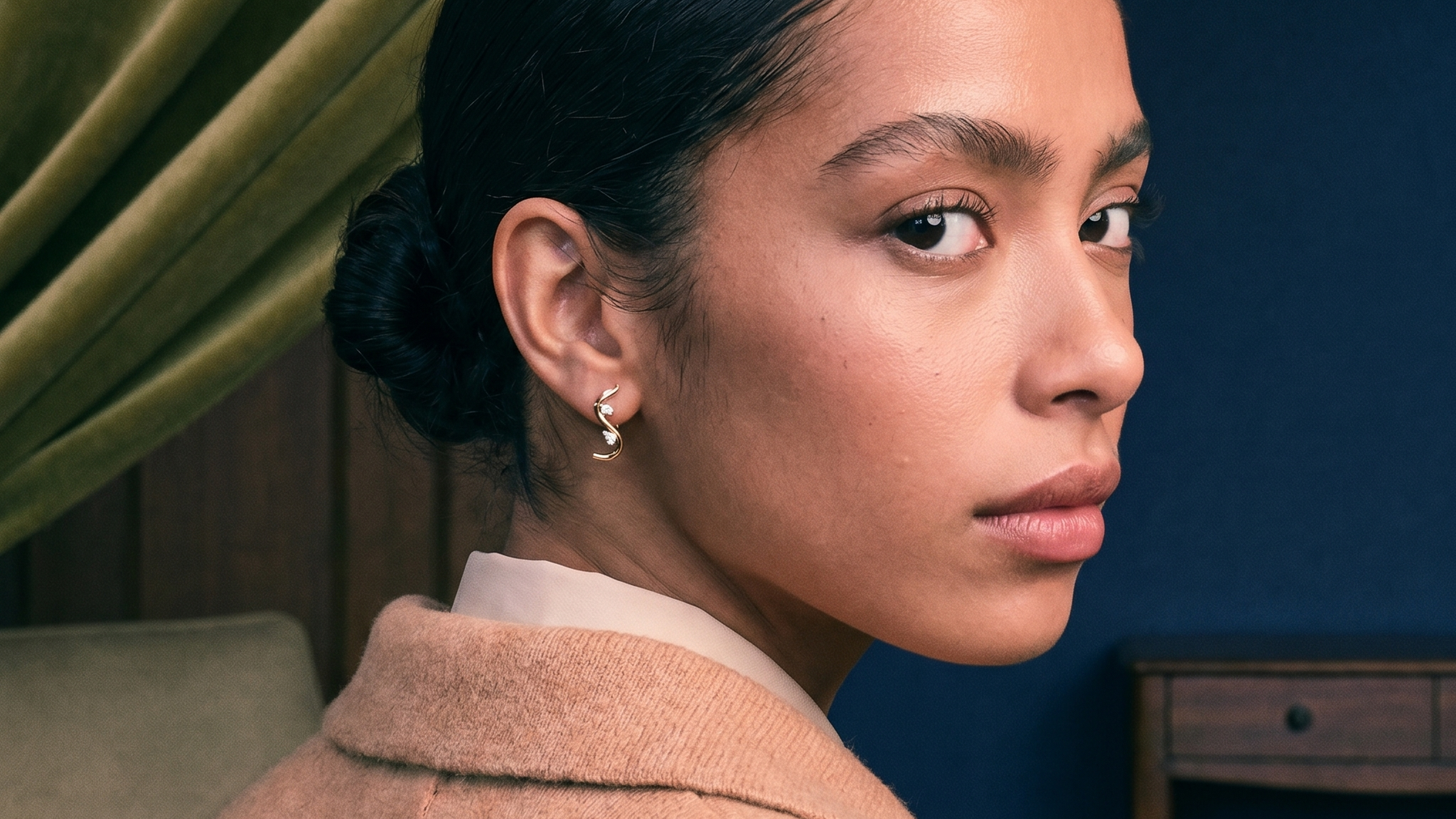 Diamond ear stack of hoops and studs styled on a model's ear