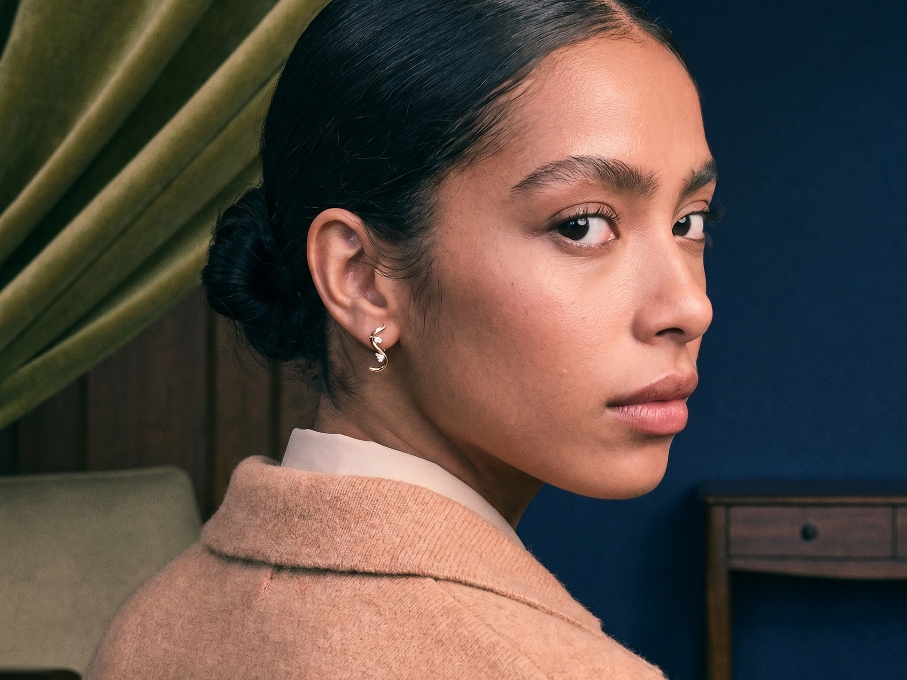 Diamond ear stack of hoops and studs styled on a model's ear