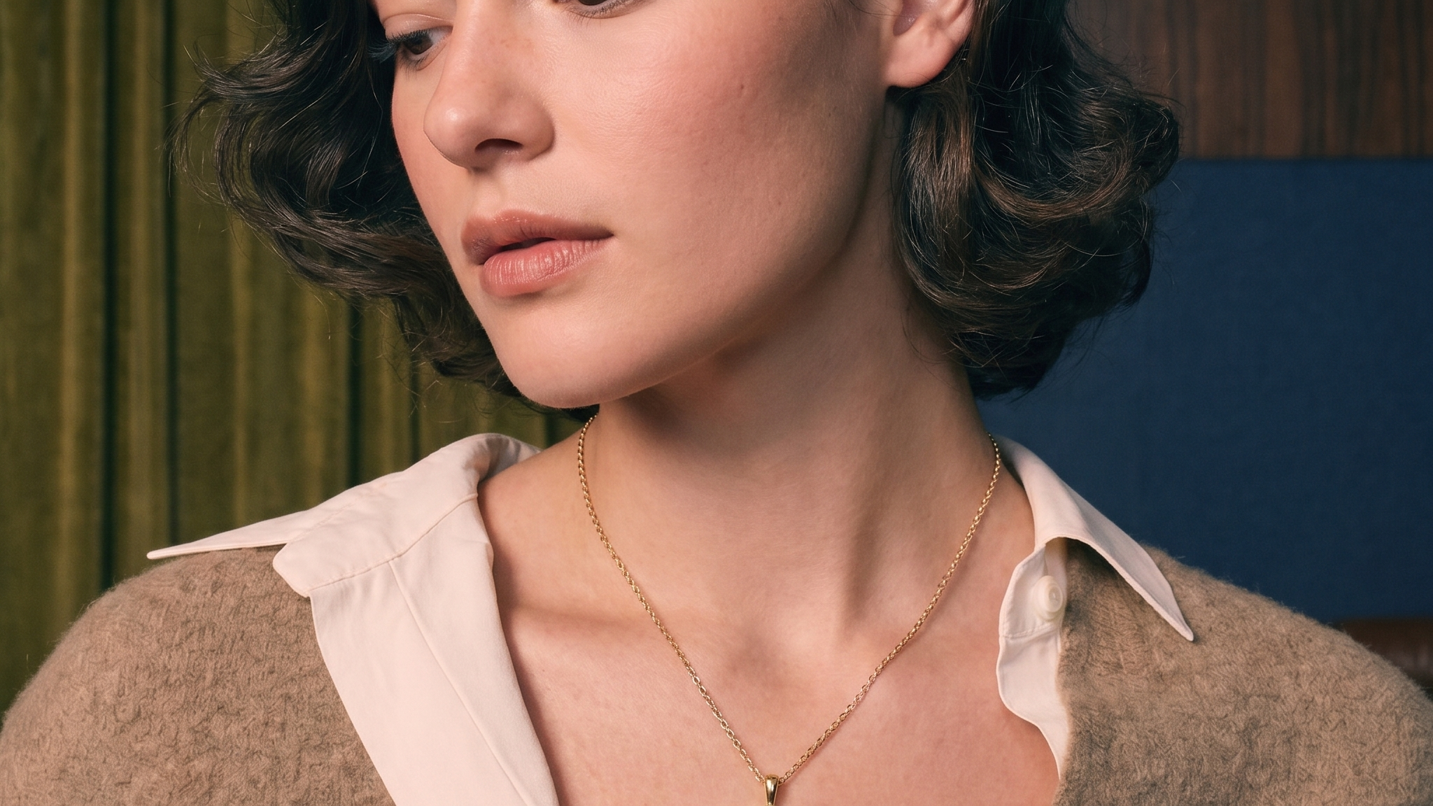 Oval lab-grown diamond solitaire pendant in gold on skin, illustrating diamond carat size and face-up scale