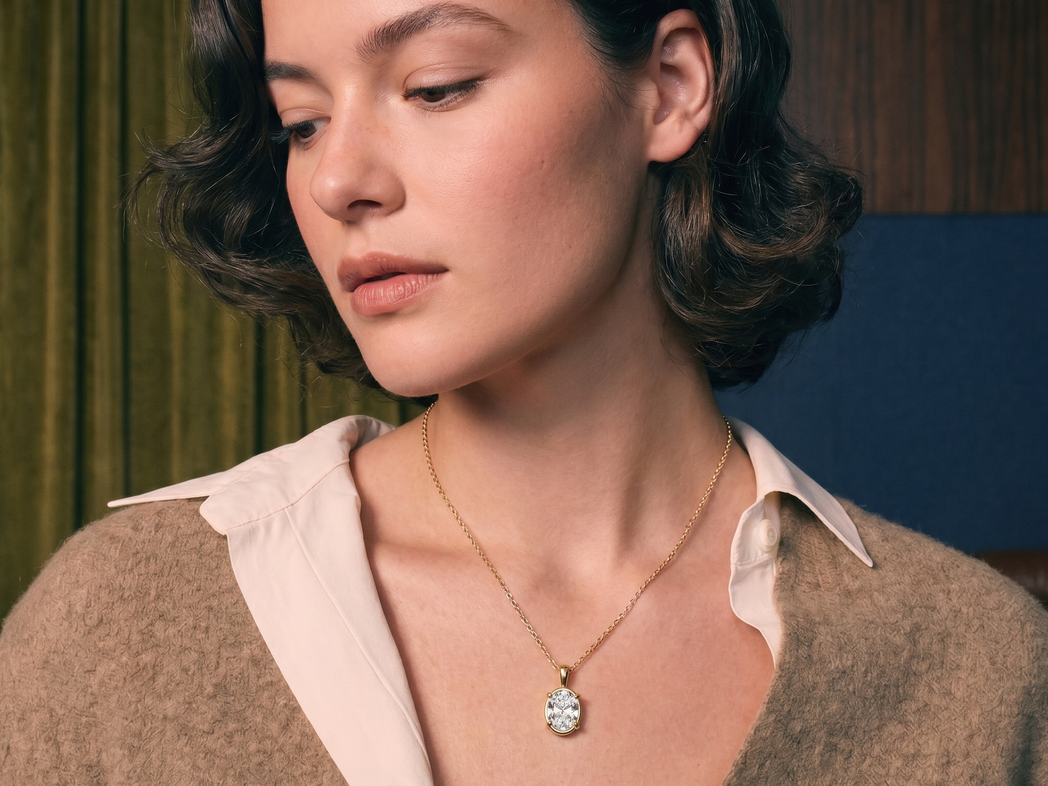 Oval lab-grown diamond solitaire pendant in gold on skin, illustrating diamond carat size and face-up scale