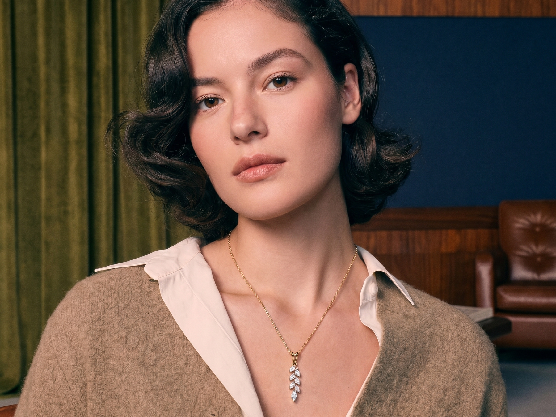 Marquise cut diamonds set in a solid gold pendant styled on a model