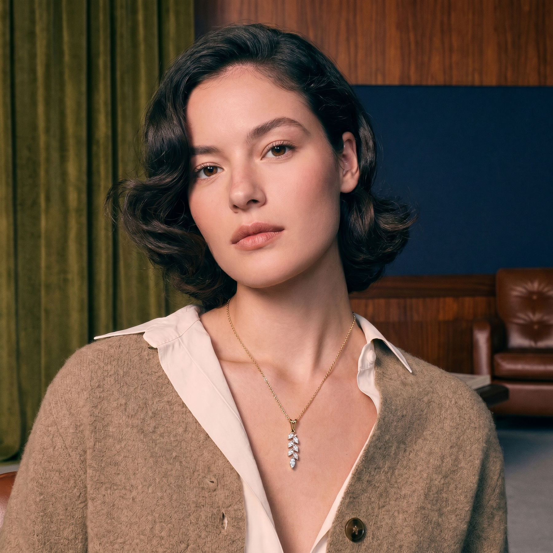 Marquise cut diamonds set in a solid gold pendant styled on a model