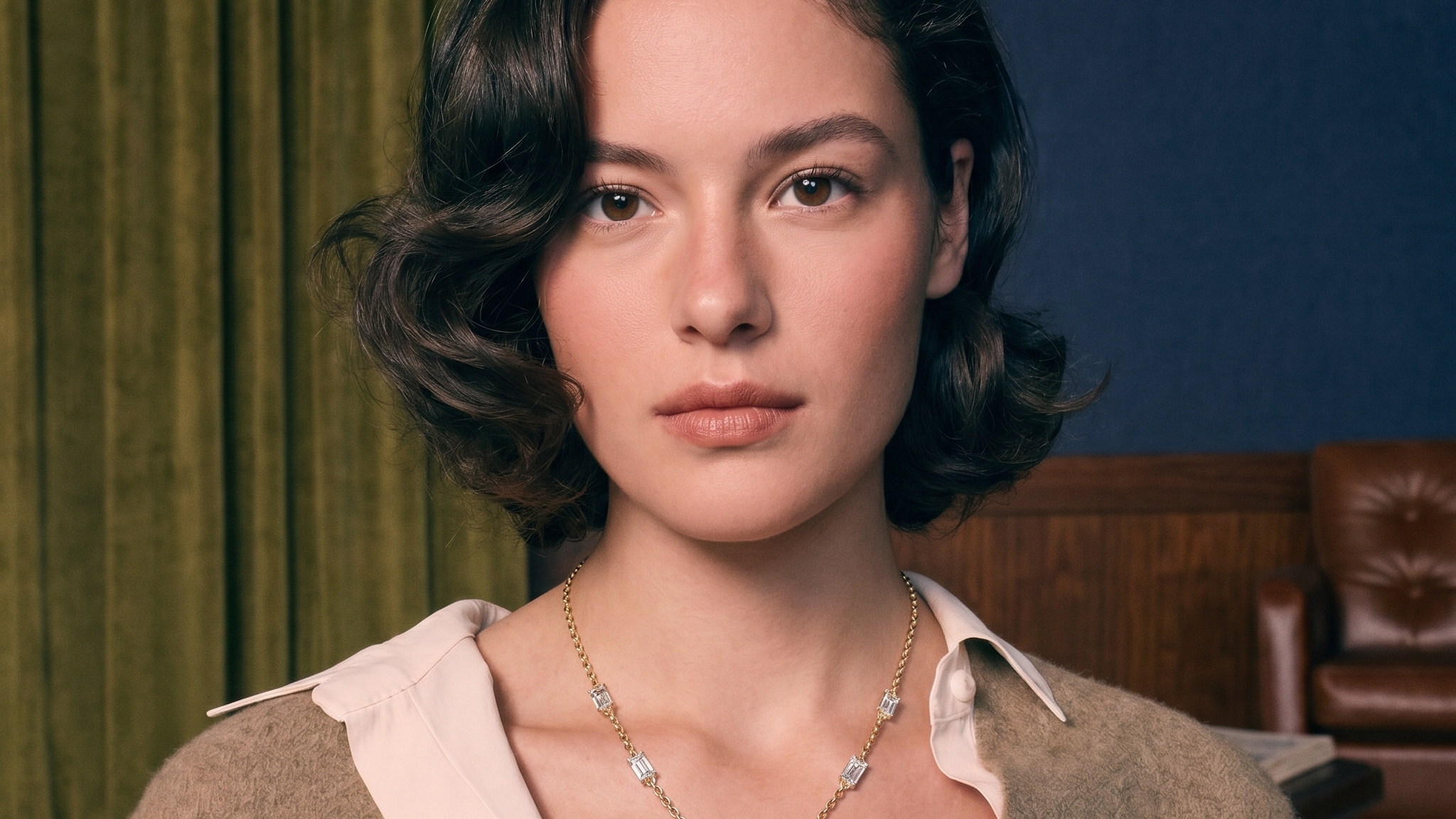 Diamond statement necklace worn on the collarbone in solid gold, editorial evening light