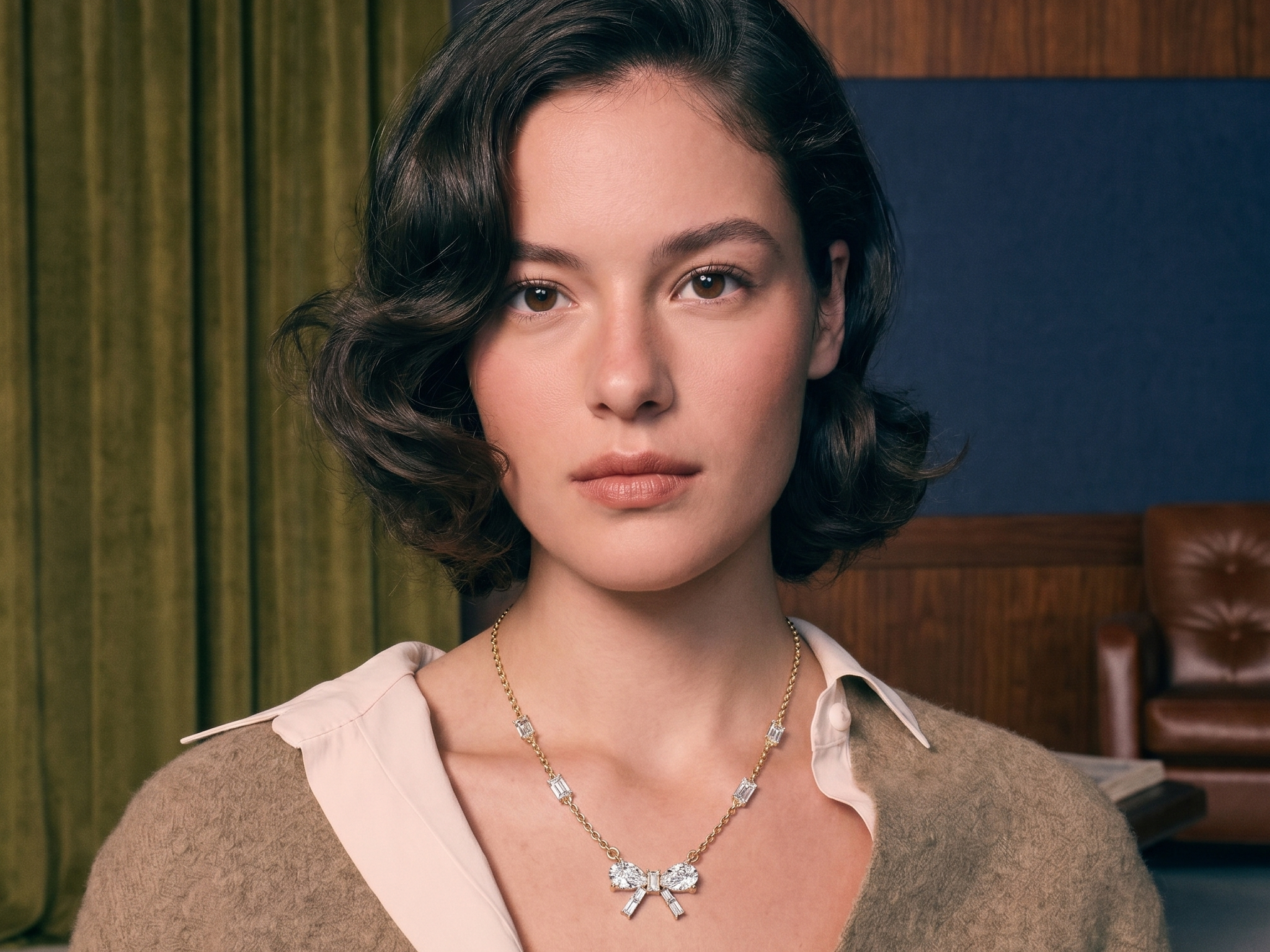 Diamond statement necklace worn on the collarbone in solid gold, editorial evening light